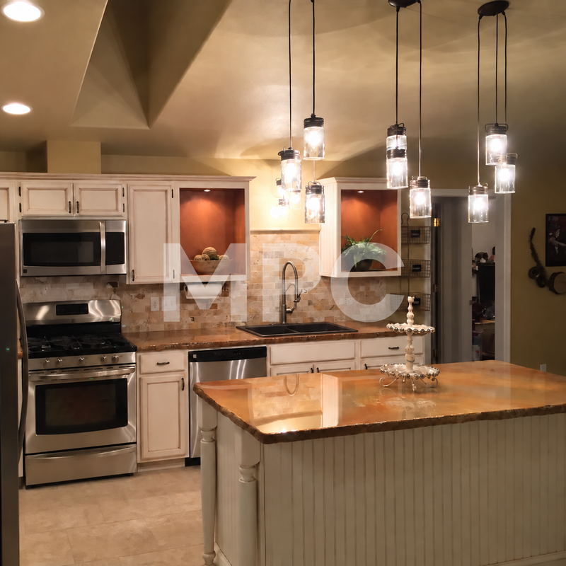 Kitchen with pendant lighting, white cabinets and a concrete countertop
